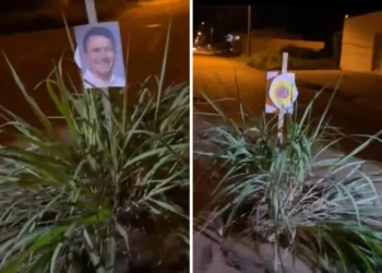 Moradores protestam com capim e foto do prefeito contra buracos em Palmas